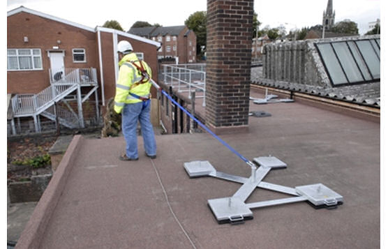 Non-Penetrating Rooftop System With Deadweight Anchor Attached To Lanyard For Restraining Movement