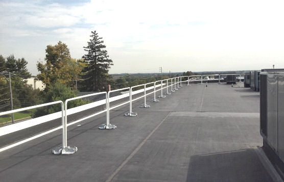 Installation of Non-Penetrating Guardrails With Flat Roof Perimeter Edge Protection Installation of Non-Penetrating Guardrails With Flat Roof Perimeter Edge Protection