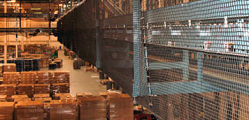 Debris Containment Netting in Distribution Warehouse