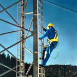 Rigid fixed track and vertical lifeline installation as personal fall arrest system.