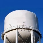 Water tower safety railings with vertical lifelines on elevated water tank.