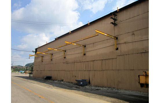 Wall-mounted jib lifeline at steel manufacturing plant in Coatesville, Pennsylvania to allow for easy inspection of steel plates.