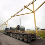 Rigid track lifelines that offer fall protection for truck loading and unloading at steel mill.