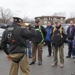 Demonstration of the proper use of fall protection body harness.